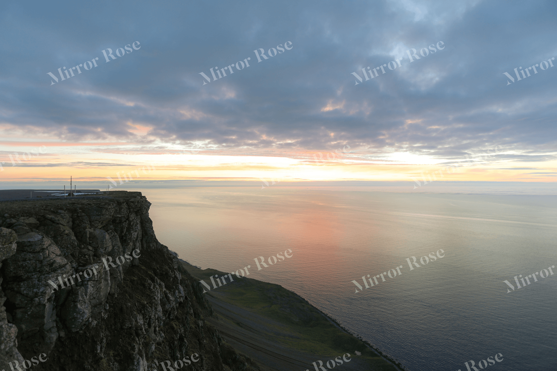 serene nordic sunset over icelandic cliffs